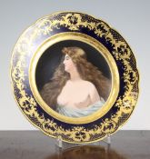 A Vienna style porcelain cabinet plate, early 20th century, the centre painted with a semi-nude red