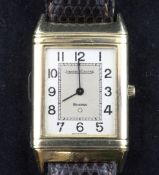 A gentleman`s 18ct gold Jaeger Le Coultre Reverso quartz wrist watch, with rectangular Arabic dial,