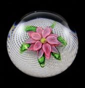 A St Louis pink dahlia paperweight, 19th century, on a swirling latticino ground, 2.5in.
