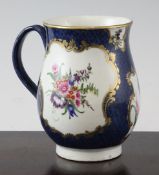 A Worcester blue scale ground baluster tankard, c.1770 decorated with painted floral sprays within