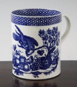 A Worcester `Parrot Pecking Fruit` pattern mug, c.1775, printed in underglaze blue after a design