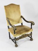 A Louis XIV style carved walnut and parcel gilt high back armchair, acanthus leaf decoration, with