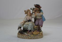 A late Meissen group of two children and a dog, 6in.