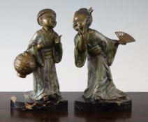 A pair of George Maxim patinated spelter bookends, modelled as Oriental children, on marble bases,