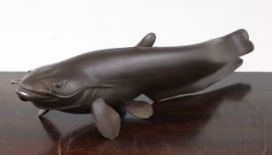 A Japanese brown patinated bronze figure of a Lung fish, seal mark beneath, 32.5cm.