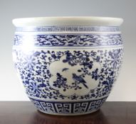 A Chinese blue and white jardiniere, early 20th century, painted with panels of birds amid flowers,