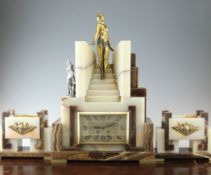 An Art Deco bronze mounted onyx and marble clock garniture, modelled as a woman and hound on a