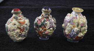 Three Chinese moulded famille rose snuff bottles, 1821-50, each bearing Qianlong marks, modelled