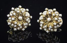 A pair of gold and cultured pearl cluster earrings/clips, of flower head form, 1in.