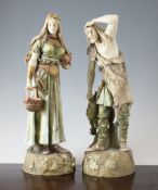 A pair of Ernst Wahliss coloured biscuit porcelain figures of a Viking and his female companion,