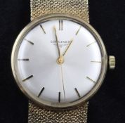 A gentleman`s 1960`s 9ct gold Longines manual wind wrist watch, with baton numerals, on 9ct gold