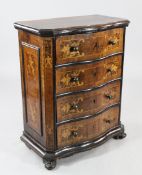 An early 18th century North Italian marquetry inlaid olive wood serpentine chest, of four long
