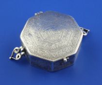 A 19th century Persian silver two handled octagonal Koran box, with hinged lid and engraved with