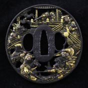 A Japanese shakudo work tsuba, 19th century, of oval form, relief decorated with biting monkeys
