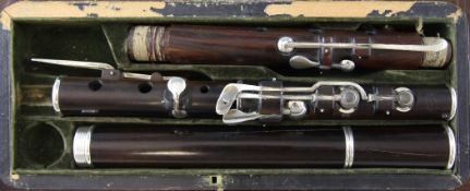 A 19th century Rudall & Rose crocus wood eight key flute, with internal tuning slide mechanism