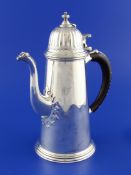 A 1960`s Queen Anne design Britannia standard silver chocolate/coffee pot, of tapering form, with