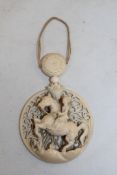 A Chinese export carved ivory equestrian pendant, 19th century, 9.3cm