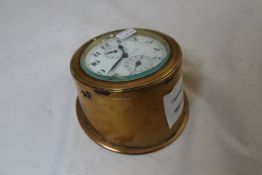 A brass cased eight day desk timepiece, with enamelled Arabic dial inscribed Observateur Time