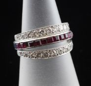 A 1940`s/1950`s platinum, ruby, sapphire and diamond set triple eternity ring, with two hinged