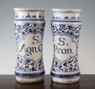 A pair of Italian maiolica albarelli, 18th century, each titled `S, AGN, CAS` and `S,PEON`, on a