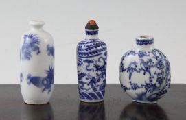 Three Chinese blue and white snuff bottles, 1800-1908, the first painted with crows on blossoming