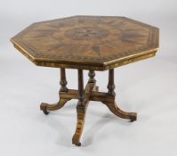 A Victorian octagonal centre table, with parquetry inlaid top, with maker`s stamp for J. Butler, on
