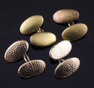 Two pairs of early 20th century 15ct gold cufflinks, of planished oval form, 21 grams.