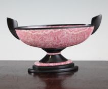 An oval rhodochrosite and black onyx two handled bowl, on stepped oval base, 9in.