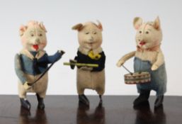 Three Schuco clockwork musical pigs, with felt bodies and tinplate feet, 4.75in.