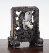 A Chinese black and white jade `dragon` carving and rosewood frame, Qianlong mark but later,