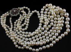 A 1960`s? four strand graduated cultured pearl choker necklace with circular white gold, ruby and