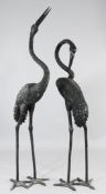 A large pair of 20th century cast bronze garden storks, H.6ft 4in.