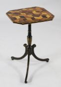 A 19th century tripod wine table, the elongated octagonal top, with perspective cube marquetry