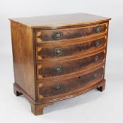 A 19th century mahogany and satinwood crossbanded bow front chest, of four long graduated drawers,