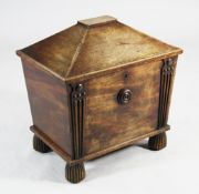 A Regency mahogany sarcophagus shape wine cooler, the front with moulded tapering columns and