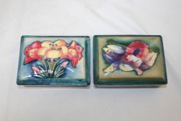 Two Moorcroft trinket boxes and covers, Freesia and Orchid patterns, c.1950, impressed marks and