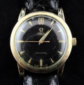 A gentleman`s 1950`s gold plated and steel Omega Seamaster automatic wrist watch, with black dial