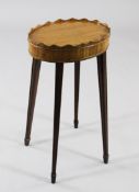 A George III style oval stainwood urn stand, with wavy gallery and moulded tapering square section