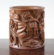 A Chinese bamboo `lotus` brush pot, finely carved in high relief with a crab and a crane amid lotus