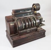 A large American National cash register with painted mahogany effect case numbered 2411935 and