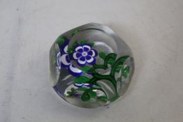 A Baccarat facetted blue and white primrose and bud paperweight, c.1850 star-cut base, 3.5in.