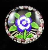 A Baccarat garlanded blue and white primrose and bud paperweight, c.1850, star-cut foot, 2.4in.