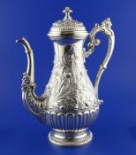 A large ornate mid 20th century Italian 800 standard silver baluster coffee pot, decorated with