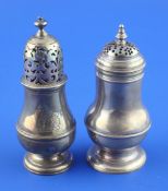 Two George I Brittania standard silver pepperettes, of baluster form, with turned finials and