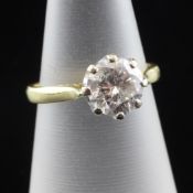 An 18ct gold solitaire diamond ring, the round brilliant cut stone weighing approximately 1.30ct,