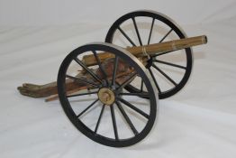 A bronze antique field artillery model canon, the adjustable barrel with Royal cipher and large