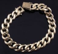 An 18ct gold curb link bracelet, 75 grams, 8.75in.