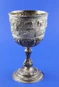 A Victorian silver goblet, embossed with masks, antelope and human torso`s, amongst scrolling