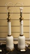 A pair of white opaline glass bottle shape table lamps, panel cut with brass fittings, H.21in.