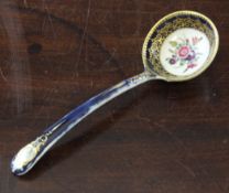 A Worcester moulded sauce ladle, c.1770, the dark blue ground decorated with painted floral sprays